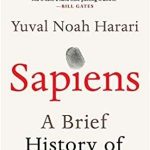 Book cover of Sapiens : a brief history of humankind By Harari, Yuval N.. The book cover is cream with mostly just text of the book title. The dot over the i in Sapiens has a thumbprint.