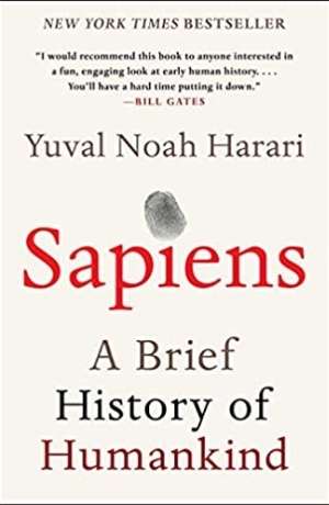 Book cover of Sapiens : a brief history of humankind By Harari, Yuval N.. The book cover is cream with mostly just text of the book title. The dot over the i in Sapiens has a thumbprint.