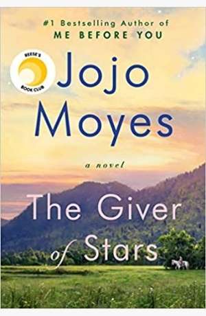 Book cover of The Giver of Stars by Jojo Moyes. A landscape of a green field with a mountain in the background with a beautiful yellowish sky. There is a woman on a horse, but she is very small by one of the trees.
