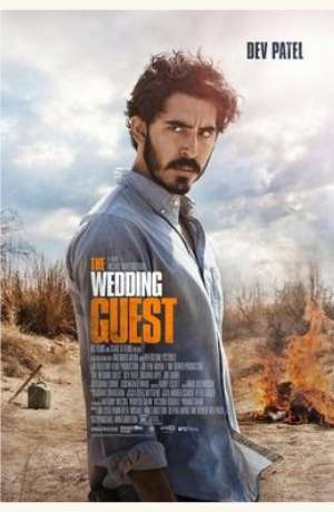 The Wedding Guest DVD cover.  A man stands in side profile, looking at us. There is a fire in the background, thought we don't know what is on fire.