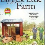 Cover of The Biggest Little Farm DVD. Two men stand beside a shed in a field of plants.