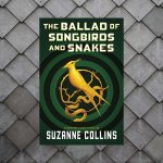 A backround of what may be grey wooden tiles are layered. Upon them is the book cover for this blog post.